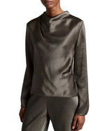 A person is wearing the Vince Long Sleeve Draped Cowl Blouse in olive green with matching pants, featuring a pleated neckline, and standing against a plain white background.