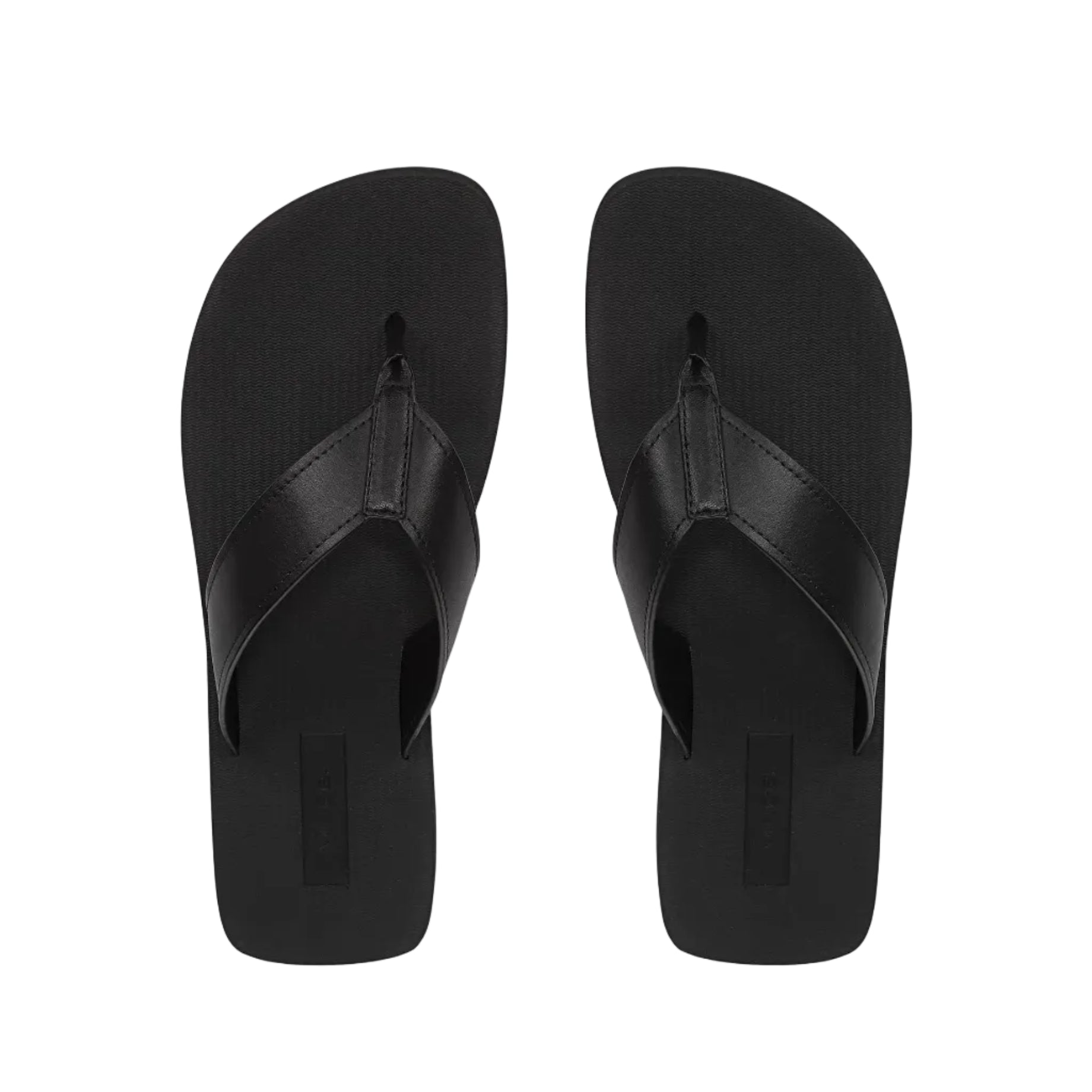 A pair of Fiji Suede Thong Sandals by vince in plain black, minimalist design, shown from above against a white background.