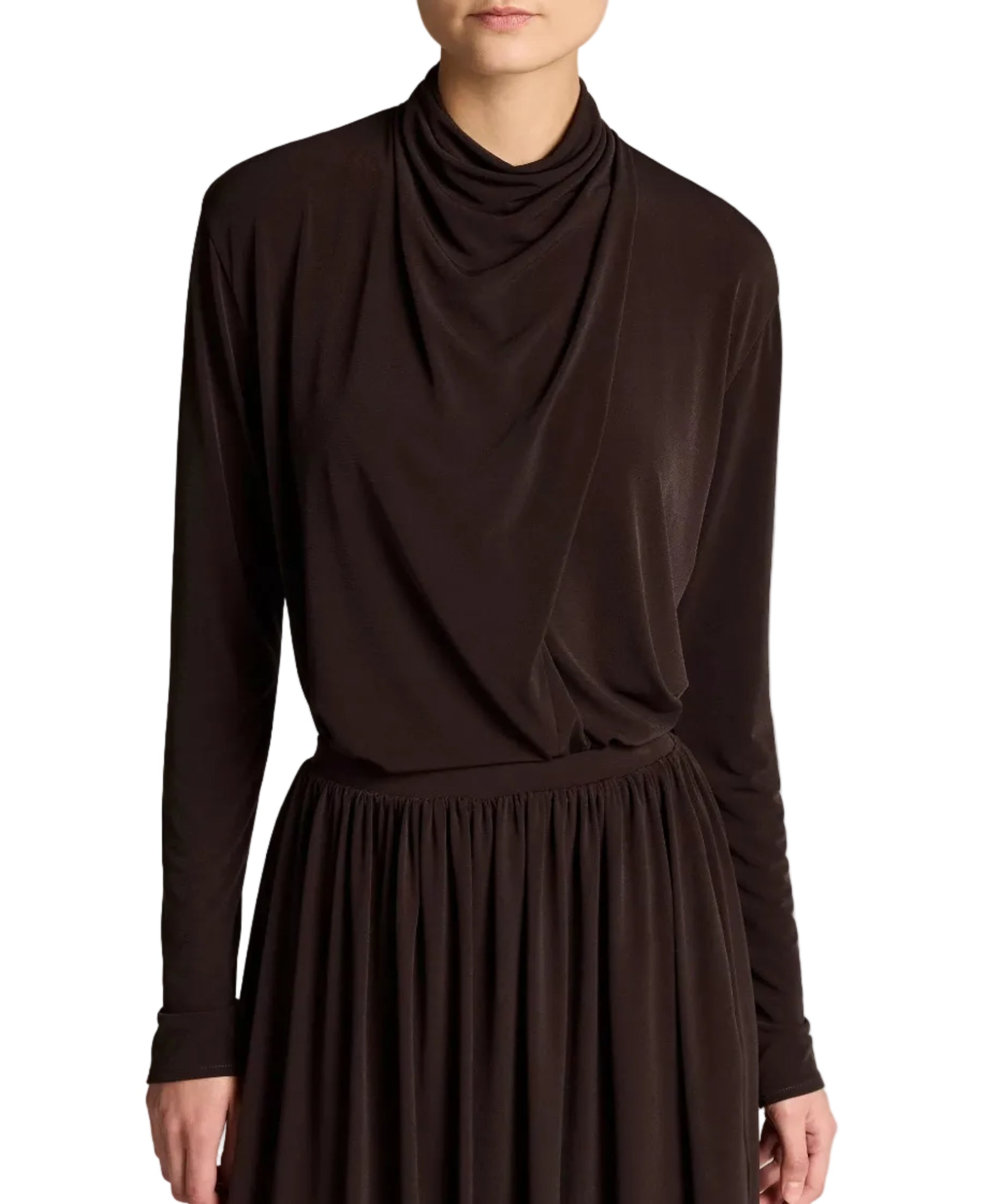 A person is shown from the shoulders to just above the knees, wearing the Vince Long Sleeve Draped Cowl Blouse and a matching dark brown skirt in matte jersey, photographed against a white background.