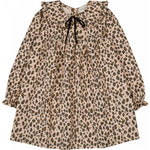 The Girls' Benjamine Corduroy Leopary Dress by Louis Louise features a beige background with brown and black leopard print, long sleeves, Peter Pan collar with ruffle details, and a black ribbon tie at the neckline.