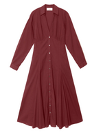 Louisa Dress by Xirena in burgundy, featuring long sleeves, a button-front closure, collared neckline, empire waist, and flared midi skirt, laid flat on a white background.