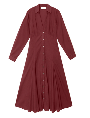 Louisa Dress by Xirena in burgundy, featuring long sleeves, a button-front closure, collared neckline, empire waist, and flared midi skirt, laid flat on a white background.