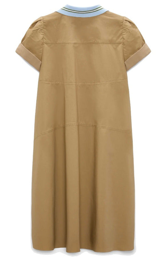 The Poplin Power Mini Shirt Dress by Dorothee Schumacher features a tan cotton poplin A-line silhouette, short cuffed sleeves, and a light blue and white striped polo collar, shown from the back.
