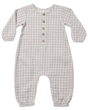 The Quincy Mae Baby Boys’ Woven Jumpsuit is a gray and white plaid long sleeve one-piece for babies, made from soft organic cotton gauze. Featuring four front buttons and elastic cuffs at the wrists and ankles, this jumpsuit is displayed laid flat on a white background.