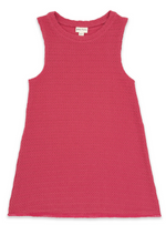 Feather 4 Arrow’s Girls’ Island Escape Dress, a sleeveless pink textured cotton dress with a round neckline, is laid flat on a white background. The visible label inside the collar highlights its authenticity, making it perfect as a stylish beach dress for sunny days.