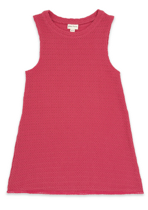 Feather 4 Arrow’s Girls’ Island Escape Dress, a sleeveless pink textured cotton dress with a round neckline, is laid flat on a white background. The visible label inside the collar highlights its authenticity, making it perfect as a stylish beach dress for sunny days.