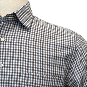 Close-up of the Dunsdale Woven Shirt by Alan Paine, featuring a black, white, and gray checked pattern, chest pocket, white buttons, and a refined fit for timeless appeal.