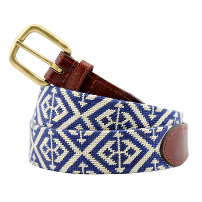 The Smathers & Branson Scarsdale Belt features a blue and white patterned needlepoint design with brown Italian leather accents and a brass buckle, shown coiled on a white background.