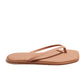 The Tkees Dylan Sandal is a handcrafted tan flip flop with thin straps and a flat sole, made from Brazilian leather, shown in a side view against a white background.
