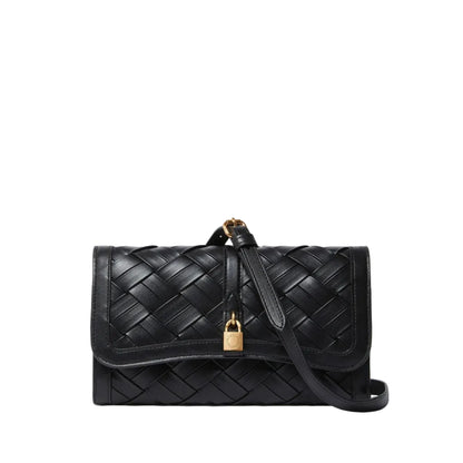 The Stella McCartney Stella Woven Ryder Wallet with Strap is a black woven leather crossbody featuring a flap closure, gold padlock detail, and an adjustable strap.