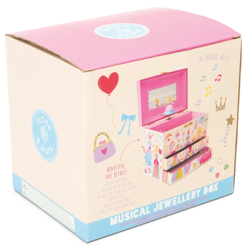 A pink and cream box adorned with illustrations and text showcases the Floss and Rock Musical Jewelry Box - Princess, featuring a ballerina, elegant decorative designs, and a product image on the front. This delightful princess jewelry box plays the enchanting carousel waltz, adding a magical touch to your treasures.