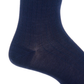 Close-up of Dapper Classics’ Classic Navy Ribbed Mid Calf Sock worn on a foot, highlighting the heel and lower leg. These durable socks are designed to maintain their shape and offer lasting comfort all day.