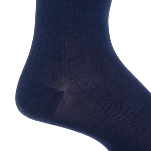 Close-up of Dapper Classics’ Classic Navy Ribbed Mid Calf Sock worn on a foot, highlighting the heel and lower leg. These durable socks are designed to maintain their shape and offer lasting comfort all day.