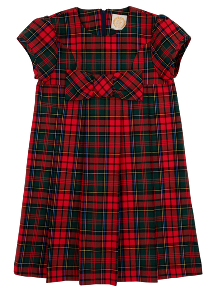 The Girls' Darcy Dress by The Beaufort Bonnet Company showcases a red, green, and navy Paces Mill Plaid, short sleeves, a front bow, and a pleated skirt, set against a white background.