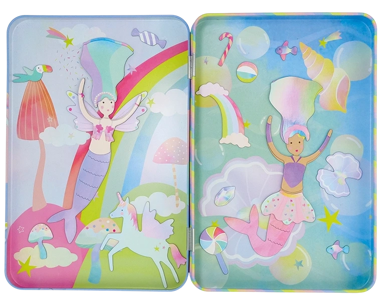 Create imaginative scenes with the Floss and Rock Fantasy Magnetic Playtime Tin, featuring a vibrant illustration of two mermaids with pastel hair, unicorns, rainbows, clouds, and candy. This magnetic tin set includes pop out magnets made from recycled materials for endless creative play in a whimsical fantasy world.