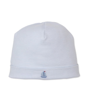 The Kissy Kissy Baby Boys’ CLB Summer Medley Striped Hat features light blue and white stripes in soft Pima cotton, with a hand-embroidered sailboat on the brim. Displayed against a plain white background, it is part of the CLB Summer Medley 26 collection.