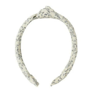 Rylee & Cru Knotted Headband in white with a subtle leaf pattern and top knot adds a stylish touch to any look; shown on a plain white background.