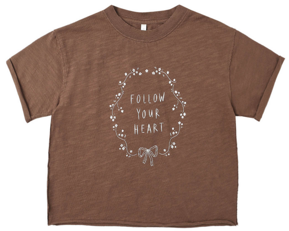 Rylee & Cru Baby Girls' and Girls' Vintage Tee: a brown short-sleeve top featuring "FOLLOW YOUR HEART" in white, accented with a floral wreath and bow for a charming, lived-in look.