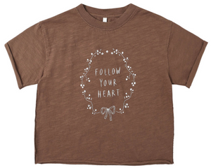 Rylee & Cru Baby Girls' and Girls' Vintage Tee: a brown short-sleeve top featuring "FOLLOW YOUR HEART" in white, accented with a floral wreath and bow for a charming, lived-in look.