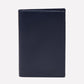 An upright Ettinger Capra Passport Case in closed, dark blue Capra leather is displayed against a plain white background.