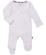 The Baby Love Lines Pointelle Footie by Magnetic Me is a light pink onesie made from organic cotton, featuring long sleeves and a front magnetic closure. It has a striped collar lining in assorted colors, making it an essential for any baby wardrobe.