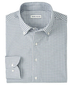 The Cashiers Performance Twill Sport Shirt by Peter Millar features a blue and white check pattern, long sleeves, button-down style, and delivers classic comfort.