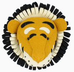 A felt tiger head wall decoration with distinct black and white accents, ideal for adding a safari-themed touch to any room, is showcased on a simple background.