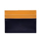The Ettinger Bridle Flat Credit Card Case features two-tone bridle hide leather in yellow and dark navy, visible stitching, embossed branding, and multiple card pockets for organized storage.