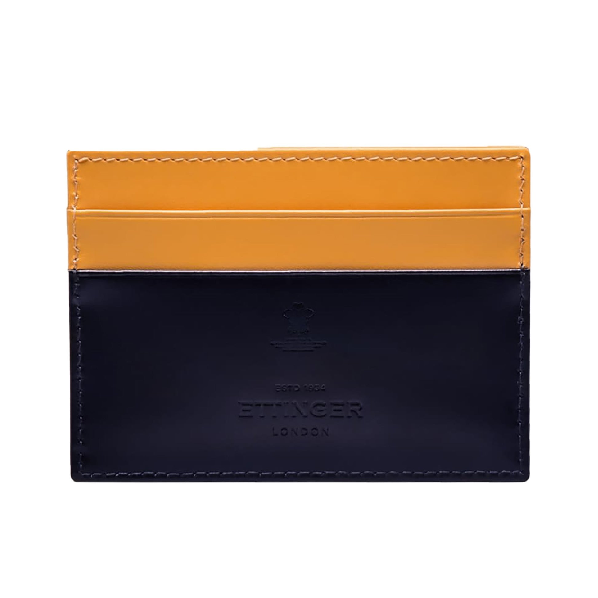 The Ettinger Bridle Flat Credit Card Case features two-tone bridle hide leather in yellow and dark navy, visible stitching, embossed branding, and multiple card pockets for organized storage.