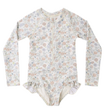 The Rylee & Cru Baby Girls' and Girls' Rashguard One-Piece features long sleeves, a pastel floral print, front zipper, and hip ruffles, shown laid flat on a white background.