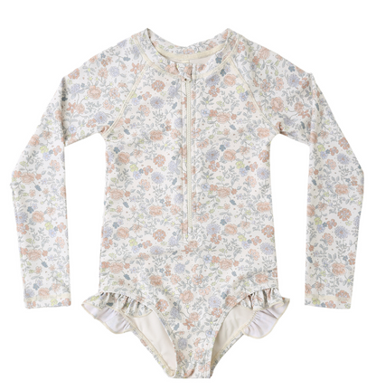 The Rylee & Cru Baby Girls' and Girls' Rashguard One-Piece features long sleeves, a pastel floral print, front zipper, and hip ruffles, shown laid flat on a white background.