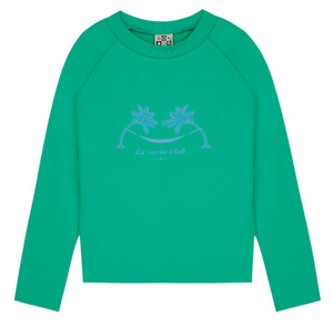 Kids' Rashguard by Bonton: a green long-sleeve swim t-shirt with UV protection, two palm trees, and "La siesta Club" printed in the center.