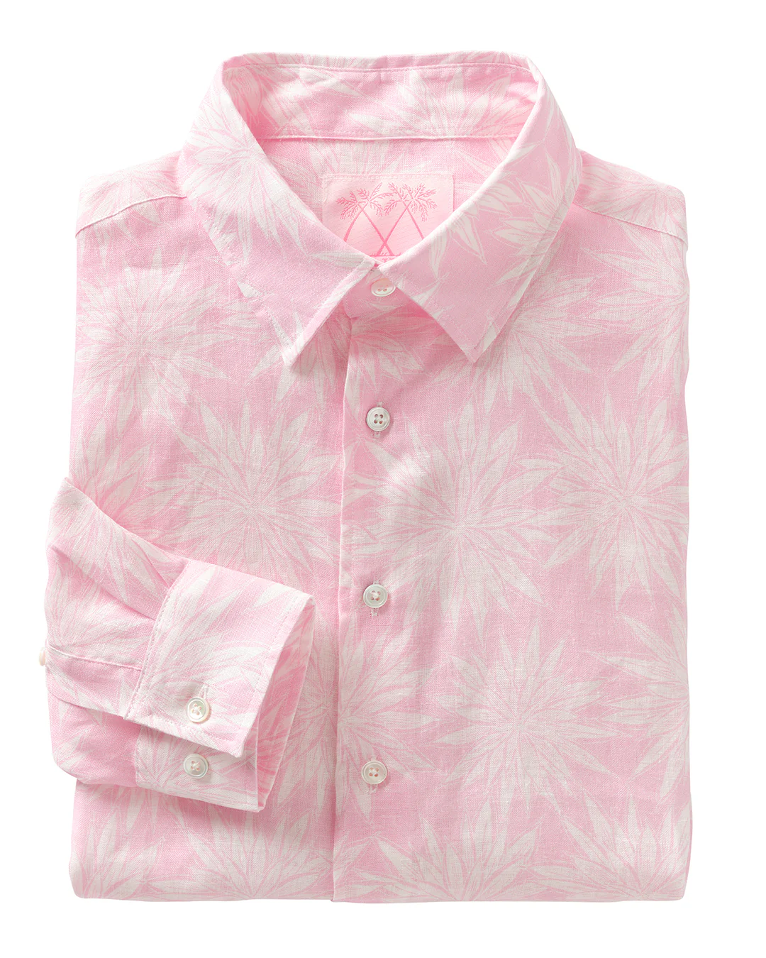 The Men's Printed Linen Shirt by Pink House Mustique features long sleeves and a neat button-up design, showcasing a white tropical leaf print on pink pre-washed linen for lasting comfort and a soft feel.