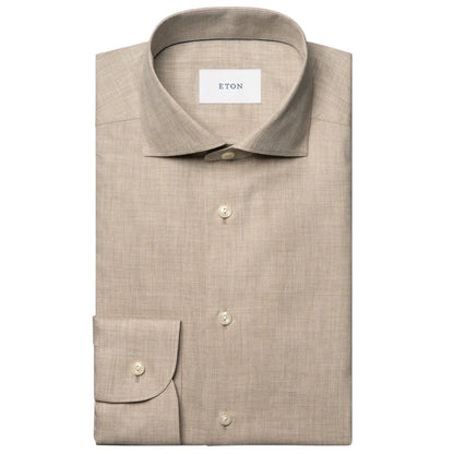 The Slim Wide Spread Solid Signature Flannel Shirt by Eton is a beige cotton flannel dress shirt with a spread collar and buttoned cuffs, ideal for cold weather and featuring the signature Eton label inside the collar.