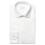 The Eton Solid King Twill Shirt is a white, wrinkle-resistant dress shirt with a pointed collar and buttoned cuffs—designed for lasting sophistication.