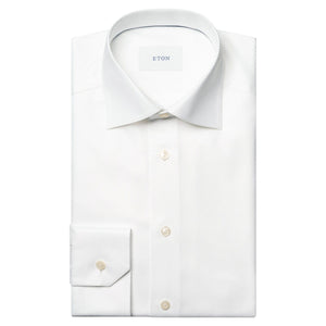 The Eton Solid King Twill Shirt is a white, wrinkle-resistant dress shirt with a pointed collar and buttoned cuffs—designed for lasting sophistication.