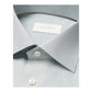 Close-up of a mid green houndstooth elevated twill shirt by Eton, featuring white buttons and a visible brand label inside the collar.