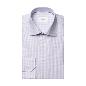 Slim Cut Away Check Twill Shirt by Eton in a light purple checkered, wrinkle-resistant fabric, featuring a pointed collar and buttoned cuffs, neatly folded and displayed on a white background.