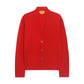The Everywear Cardigan by Guest in Residence is a red cashmere V-neck cardigan with three buttons, shown on a white background.