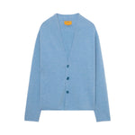 The Everywear Cardigan by Guest in Residence is a light blue cashmere V-neck sweater with three front buttons and long sleeves, shown on a plain white background.