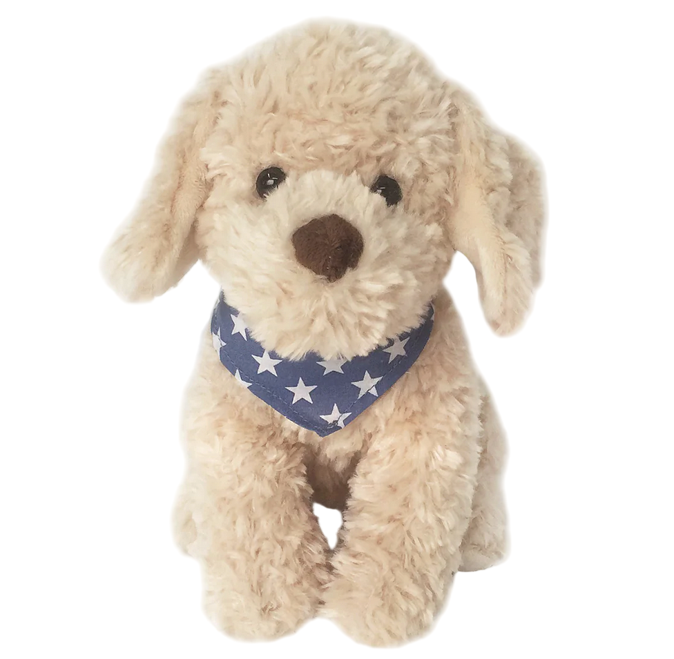 Bentley the Golden Doodle by Mon Ami sits upright against a white background, wearing a blue star bandana and showing off its cute beige fur.