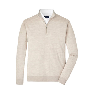The Peter Millar Excursionist Flex Quarter-Zip Sweater in beige Merino wool features a standing collar, layered over a white collared shirt and displayed on a white background.