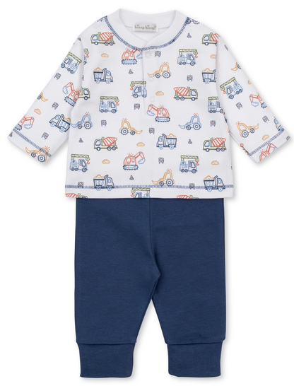 Introducing the Kissy Kissy Baby Boys’ Construction Demo Pant Set, featuring a white long-sleeve shirt adorned with a fun construction print and paired with soft, solid navy blue elastic-waist pants.