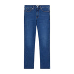 Introducing the L’Homme Slim Denim by Frame—a pair of mid-rise blue jeans featuring a slim, straight-leg cut, classic five-pocket styling, and a button closure. Crafted from premium European denim, these jeans are displayed laid flat on a white background to showcase their timeless, modern fit.