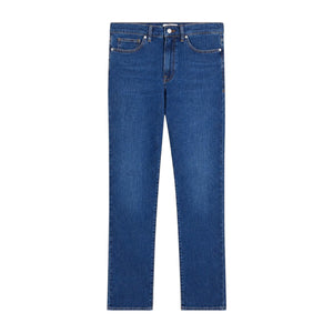 Introducing the L’Homme Slim Denim by Frame—a pair of mid-rise blue jeans featuring a slim, straight-leg cut, classic five-pocket styling, and a button closure. Crafted from premium European denim, these jeans are displayed laid flat on a white background to showcase their timeless, modern fit.