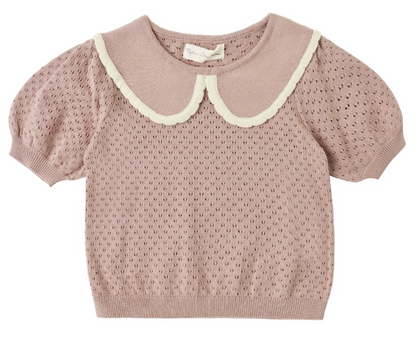 The Girls’ Pointelle Collared Top by Rylee & Cru, a pink knit short-sleeve sweater featuring a vintage-inspired eyelet pattern and a white scalloped Peter Pan collar, is displayed laid flat on a white background.