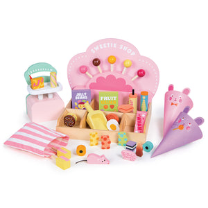 Bring vintage charm to your playroom with the Sweetie Pic'n' Mix Shop by Tender Leaf Toys! This delightful wooden candy shop playset includes a cute scale, colorful pic n mix sweets, candy boxes, two charming animal cone bags, and a pastel-hued decorative shop backdrop. Perfect for inspiring imaginative play and capturing retro sweet shop vibes.