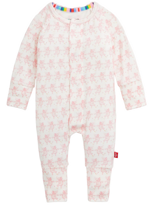 The Magnetic Me Baby Trunkettes Modal Convertible Coverall is a long-sleeve onesie made from ultra-soft modal fabric, showcasing a pale pink animal print and a rainbow-striped neckline, and designed with easy magnetic closures for quick changes—shown against a white background.