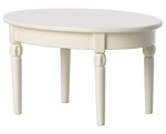 An ivory-colored, oval-shaped wooden Maileg Dining Table with four carved legs, ideal for a charming mouse castle dining setup with your Maileg mice.