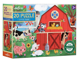 The Eeboo Little Farm 20-Piece Puzzle is a colorful kids’ barnyard puzzle box featuring a red barn, assorted farm animals, and green grass, with charming illustrations by Jill Howarth—perfect for ages 3 and up.